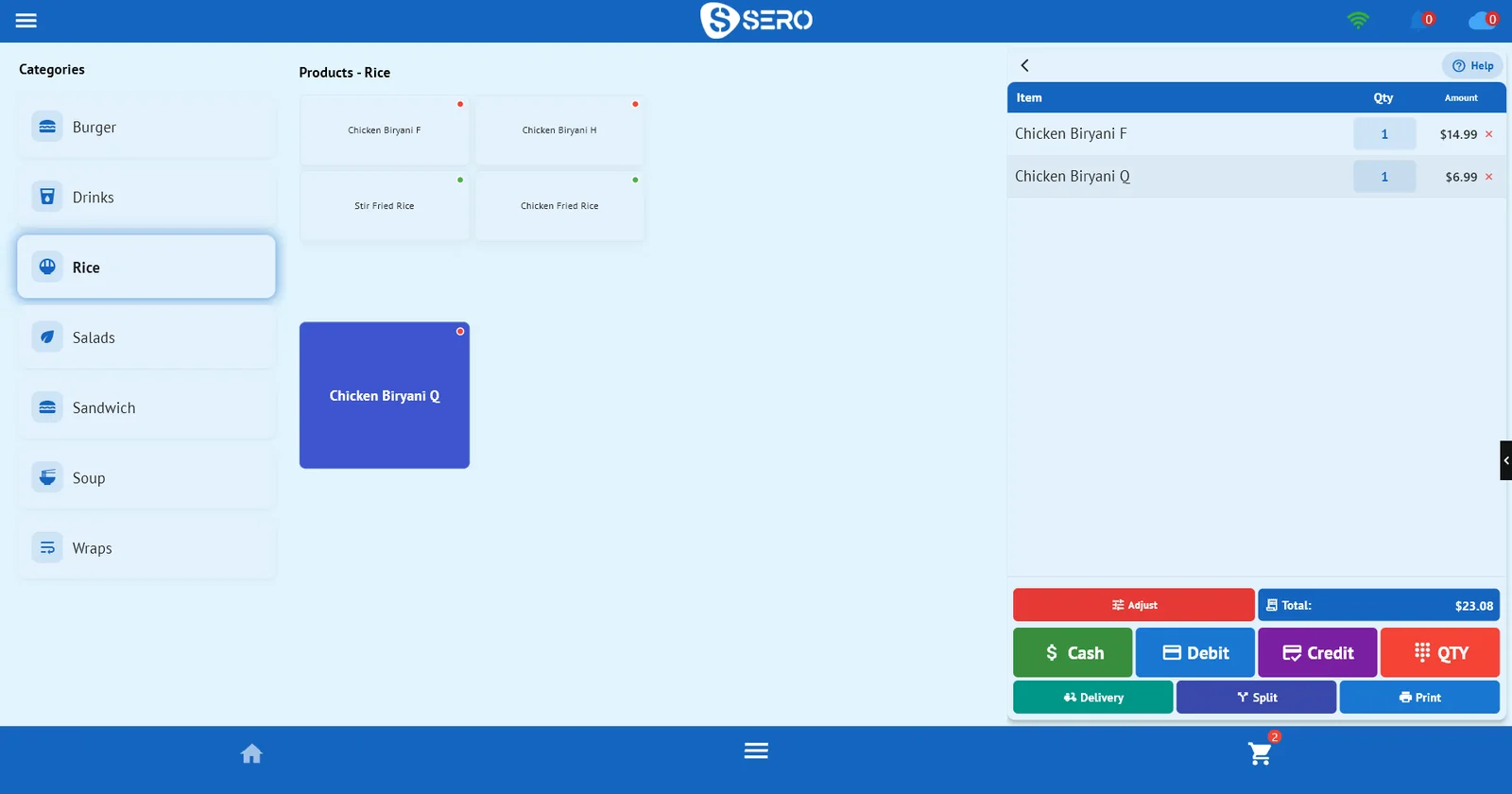 SeroPOS in QSR Mode: categories on the left, plain product buttons with food-type dots and a blue double-height button, and the cart on the right with two biryanis totalling $23.08 above Cash, Debit, Credit and QTY